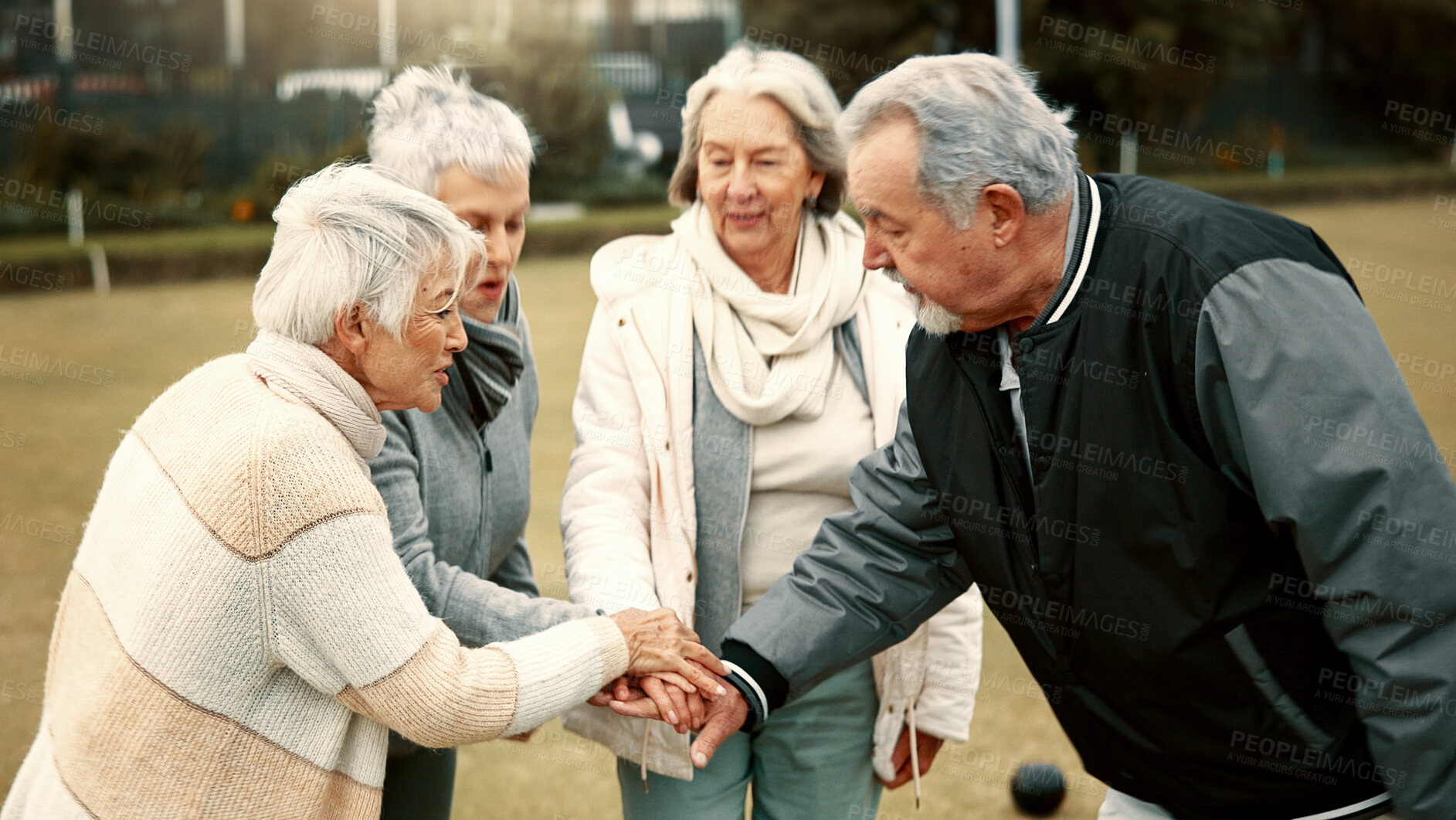 Buy stock photo Hands, motivation and senior friends in a huddle outdoor for support, celebration or unity during a game. Teamwork, trust and community with a group of elderly people in a park for team building