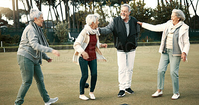 Bowls, celebration and hugging with senior friends outdoor, cheering together during a game. Motivation, support or applause and a group of elderly people clapping while having fun with a hobby