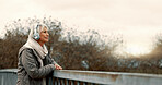 Bridge, senior woman and headphones with music and thinking outdoor with view. Elderly female person, web radio and mockup space feeling relax in retirement with audio and freedom on calm holiday