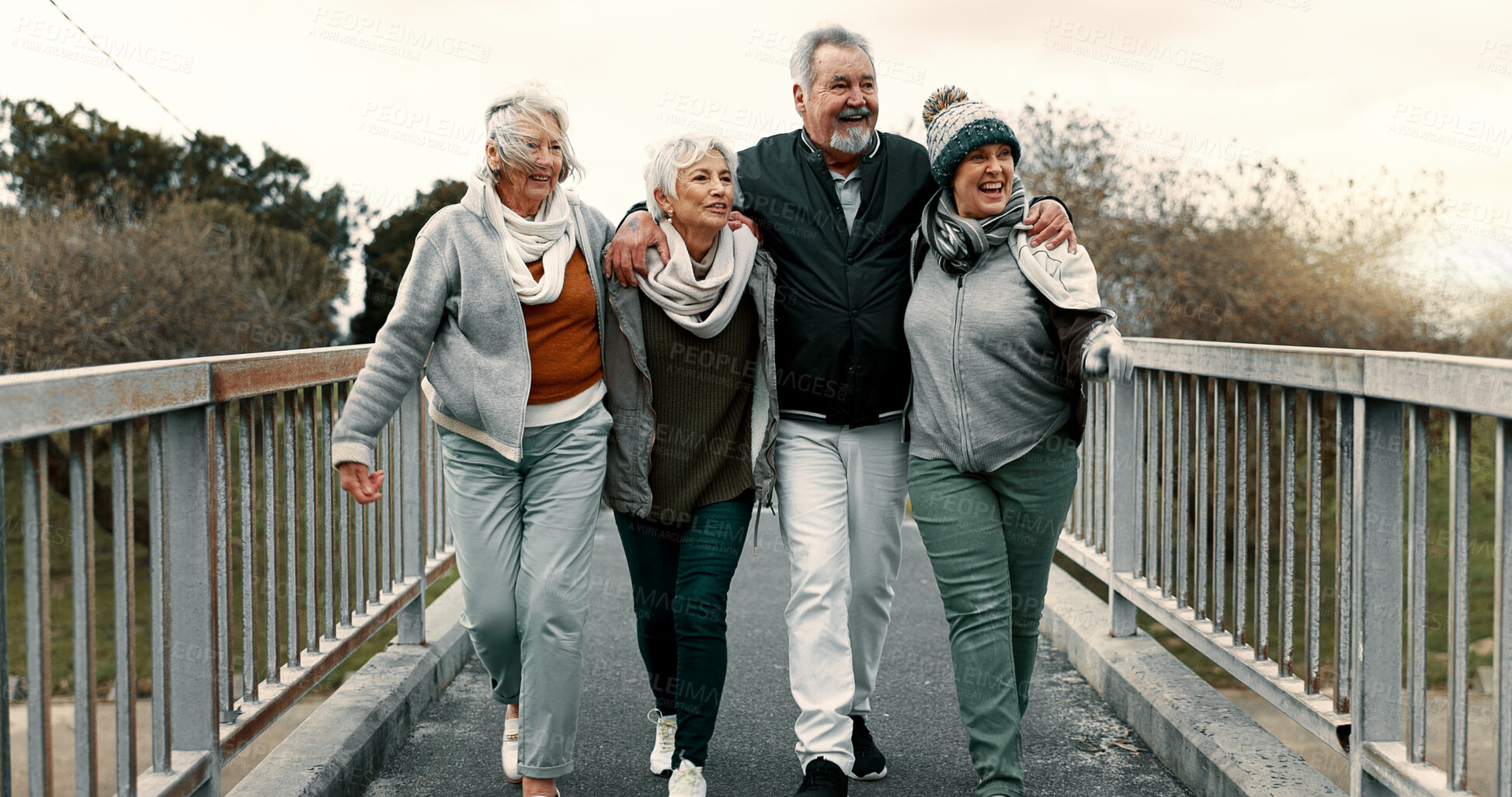 Buy stock photo Senior people, fitness group and bridge with laugh, care or  walk for training together, health or retirement. Elderly friends, hug and conversation with exercise, outdoor workout or pointing in park