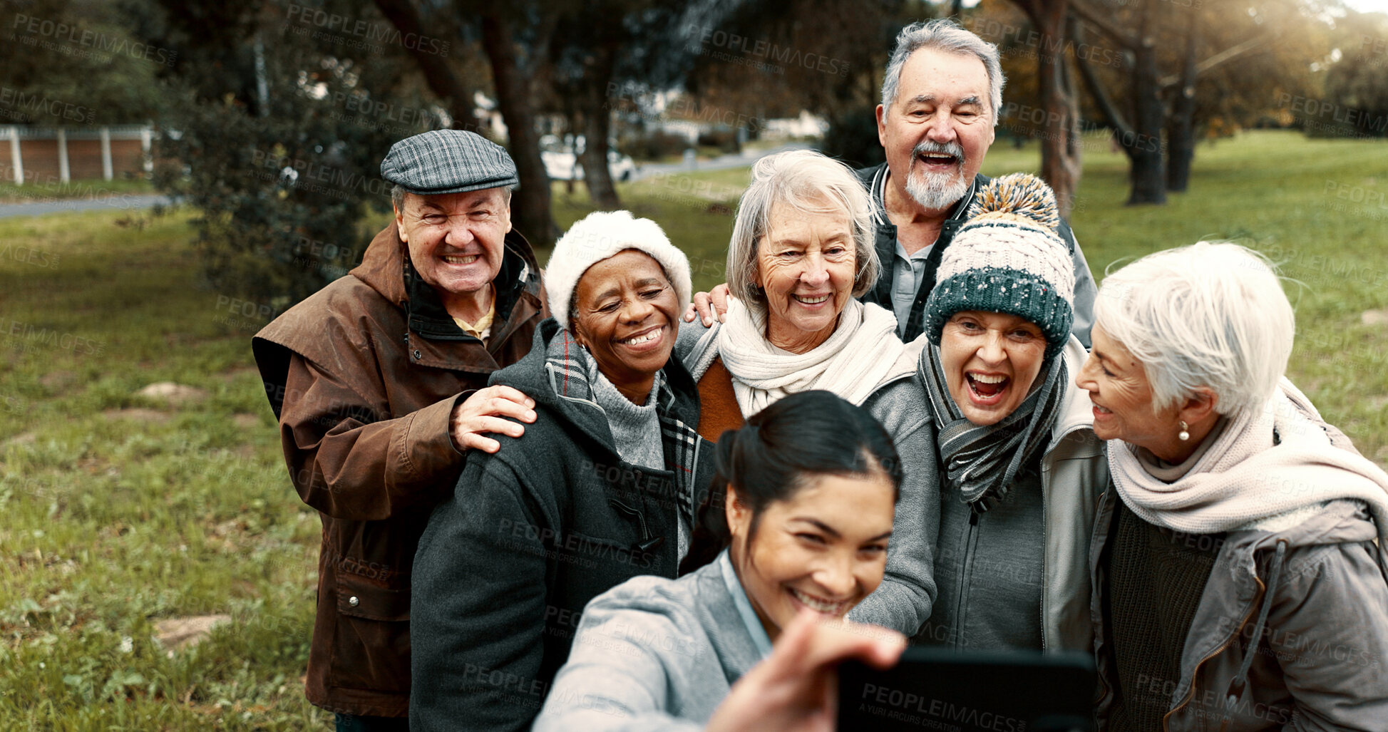 Buy stock photo Nature, selfie and senior friends with woman while walking in outdoor garden for fresh air. Diversity, happy and group of elderly people in retirement taking picture with young female person in park.