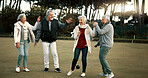 Bowls, celebration and hugging with senior friends outdoor, cheering together during a game. Motivation, support or applause and a group of elderly people clapping while having fun with a hobby