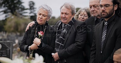 Death, funeral and elderly couple sad together at pain or grief for death and loss during a ceremony. Rose, support or empathy with a senior man and woman feeling depression at a memorial service