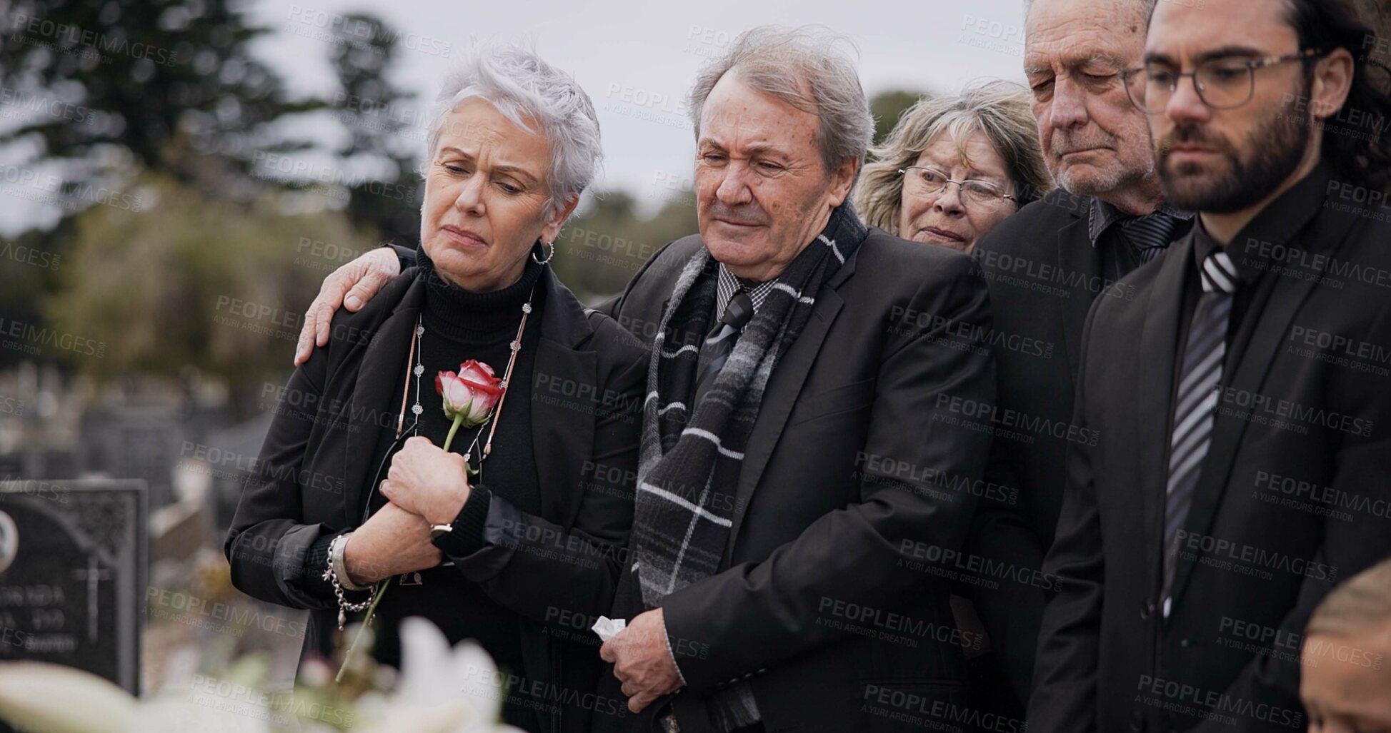 Buy stock photo Death, funeral and elderly couple sad together at pain or grief for death and loss during a ceremony. Rose, support or empathy with a senior man and woman feeling depression at a memorial service