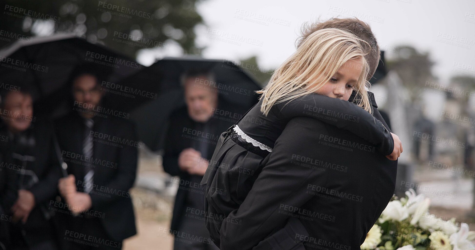 Buy stock photo Sad, hug and a father and child at a funeral with depression and mourning at the graveyard. Holding, young and a dad with care and love for a girl kid at a cemetery burial and grieving together