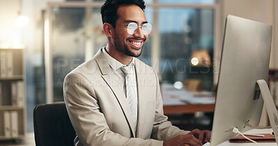Office computer, night and happy man typing email, communication and networking with business consultant. Smile, reading and professional person contact social media user, network admin or employee