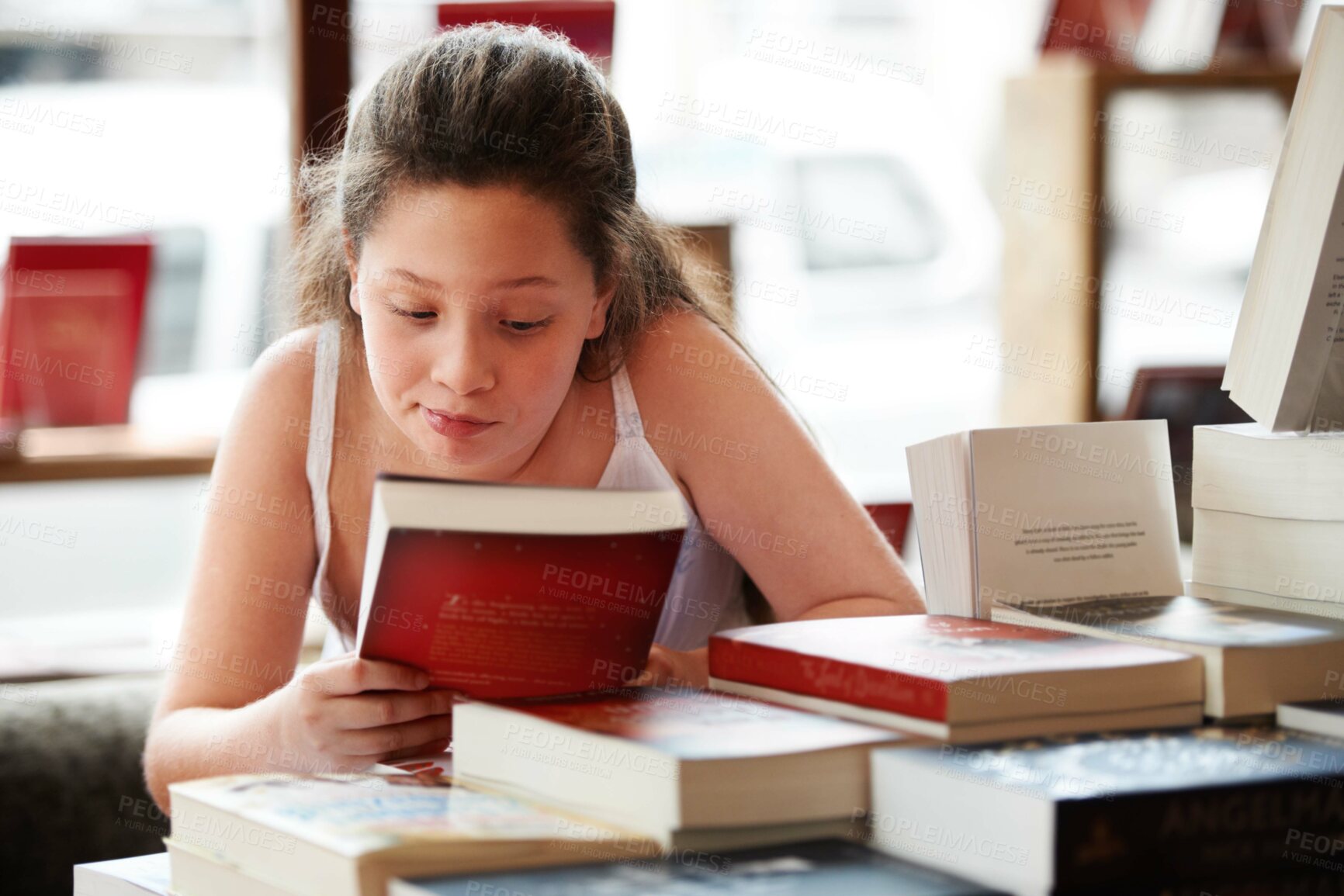 Buy stock photo Girl child, reading book and education, story for knowledge or entertainment with customer in bookshop. Library, store and learning for development and growth, fiction or literature with young kid