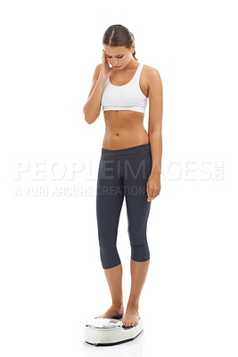 Buy stock photo Scale, weight loss and unhappy woman check diet fail, negative training results or bad exercise progress. Studio, sad or model with mass gain risk, BMI problem or fitness disaster on white background