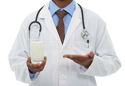 Buy stock photo Doctor, hands and studio person with milk for wellness diet, healthcare nutrition or calcium benefits. Beverage glass, hydration drink and closeup nurse show dairy recommendation on white background
