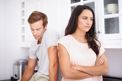 Buy stock photo Couple, fight and angry with conflict or drama in life, mistake or marriage fail with anxiety and stress at home. Frustrated people arguing in kitchen, cheating problem or crisis with risk of divorce