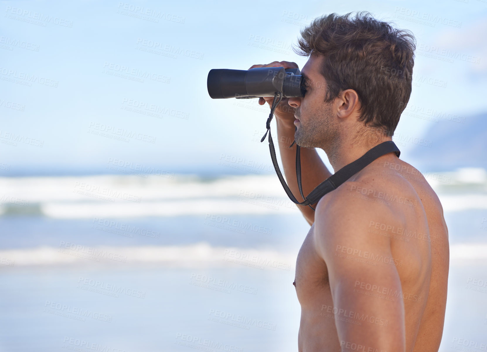Buy stock photo Man, binoculars and lifeguard on beach in search or checking danger for health and safety. Face of male person in fitness for security, bay watch or patrol by the ocean coast or sea in surveillance