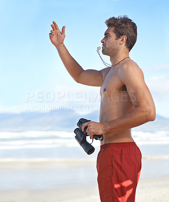 Buy stock photo Man, binoculars and lifeguard on beach with whistle in security, emergency or health and safety. Young male person monitoring, bay watch or patrol by the ocean coast or sea in surveillance or danger