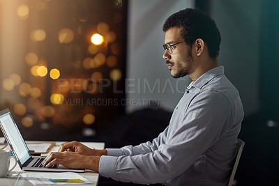 Buy stock photo Businessman, laptop and typing in research, analysis or web design on work desk at office. Employee man sitting and working on computer in overtime at night for dedication to meet project deadline