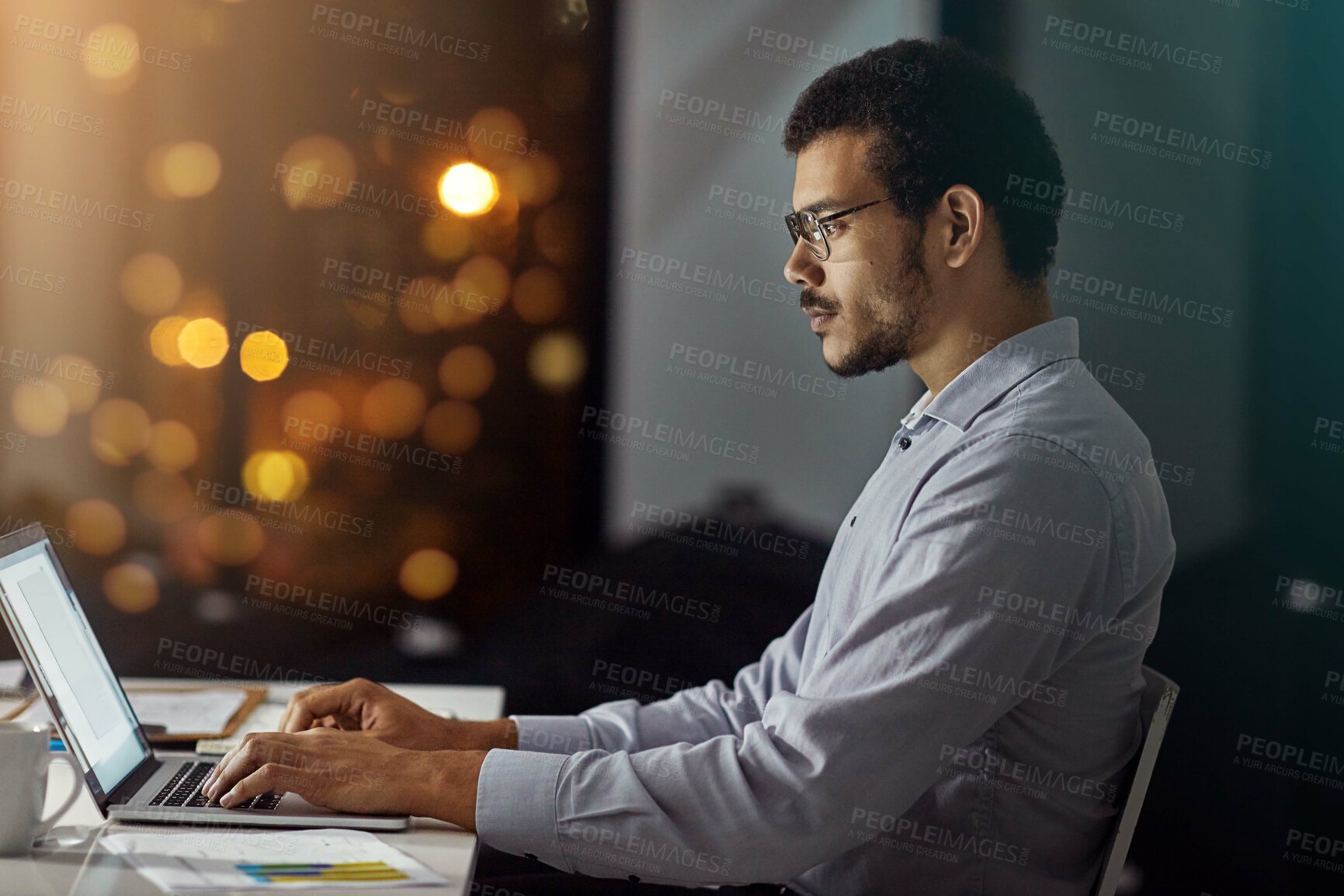 Buy stock photo Businessman, laptop and typing in research, analysis or web design on work desk at office. Employee man sitting and working on computer in overtime at night for dedication to meet project deadline