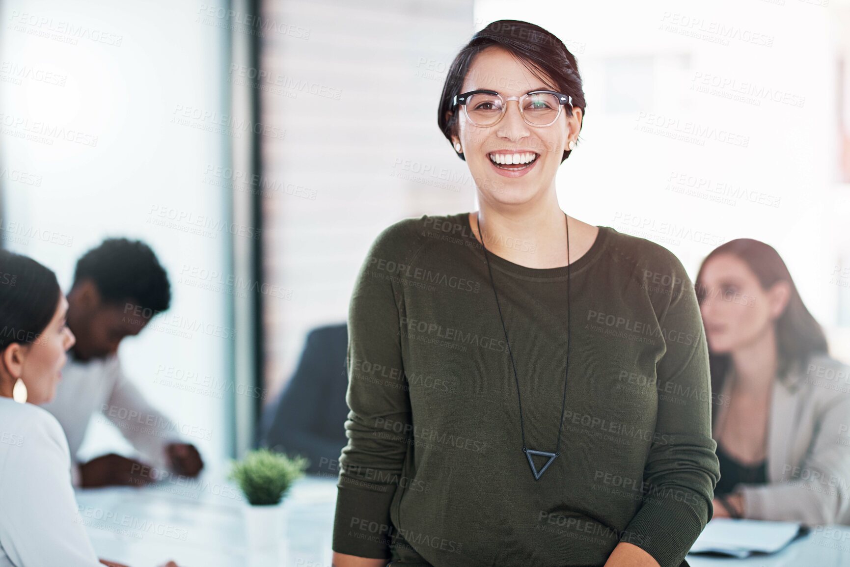 Buy stock photo Portrait of a businesswoman in an office with her colleagues in the background