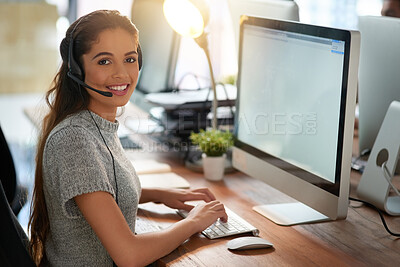 Buy stock photo Shot of a young female agent working in a call center
