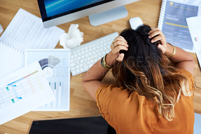 Buy stock photo Cropped shot of an unrecognizable businesswoman suffering from a headache while in her office during the day