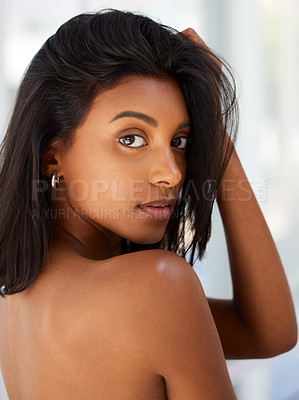 Buy stock photo Portrait, beauty and confidence with an indian woman in her home, feeling beautiful or sensual. Face, hair and relax with an attractive young female in her apartment looking confident or feminine