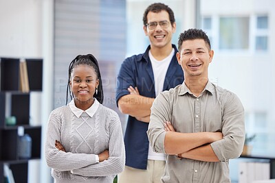 Buy stock photo Shot of a diverse group of businesspeople standing together in the office with their arms folded