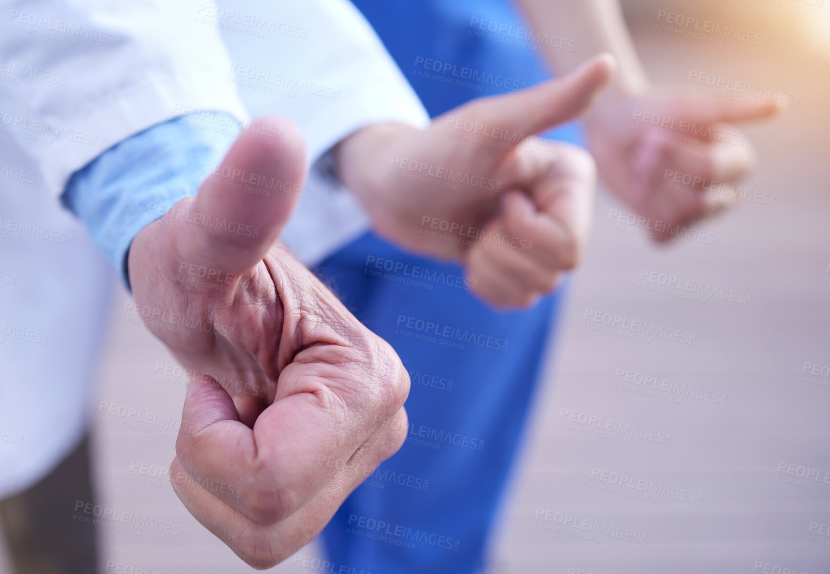 Buy stock photo Hands, doctor and professionals with thumbs up, medical and agreement with teamwork and cooperation. Feedback, review and hand gesture in hospital with thank you or support with healthcare or closeup