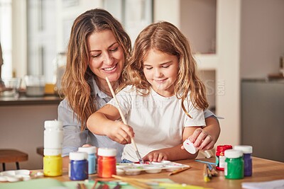 Mother, girl and painting art in house studio, home or creative space with brush, oil paint or palette. Happy smile mom, child or kid bonding in relax design or class activity for adhd or autism help