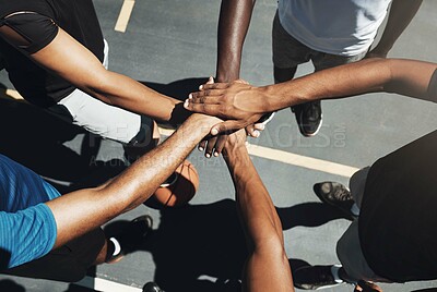 Buy stock photo Hands, team and basketball in support, trust and coordination above for unity on the outdoor court. Hand of people in sports teamwork piling together for motivation and collaboration to win game