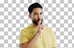 Secret, man and portrait in studio for sign of privacy, surprise sales and confidential deal on white background. Indian model with finger on lips for quiet, gossip news and mystery emoji to whisper