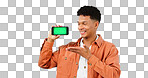 Happy man, show and phone with greenscreen in studio for social media mock up on blue background in Cape Town. Male model, hand and mobile app in presentation of online, deal or promotion by internet