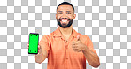 Portrait, man and thumbs up for phone with green screen, space and agreement in studio on white background. Happy model, smartphone and yes emoji for newsletter, promotion and advertising information