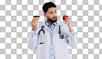 Healthy, diet and doctor with choice of food, apple or donut  in hands for nutrition in studio white background. Nutritionist, thinking and man with a decision for health with fruit and dessert