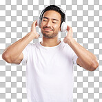 Handsome young mixed race man listening to music while standing in studio isolated against a blue background. Hispanic male streaming his favourite playlist online using wireless headphones