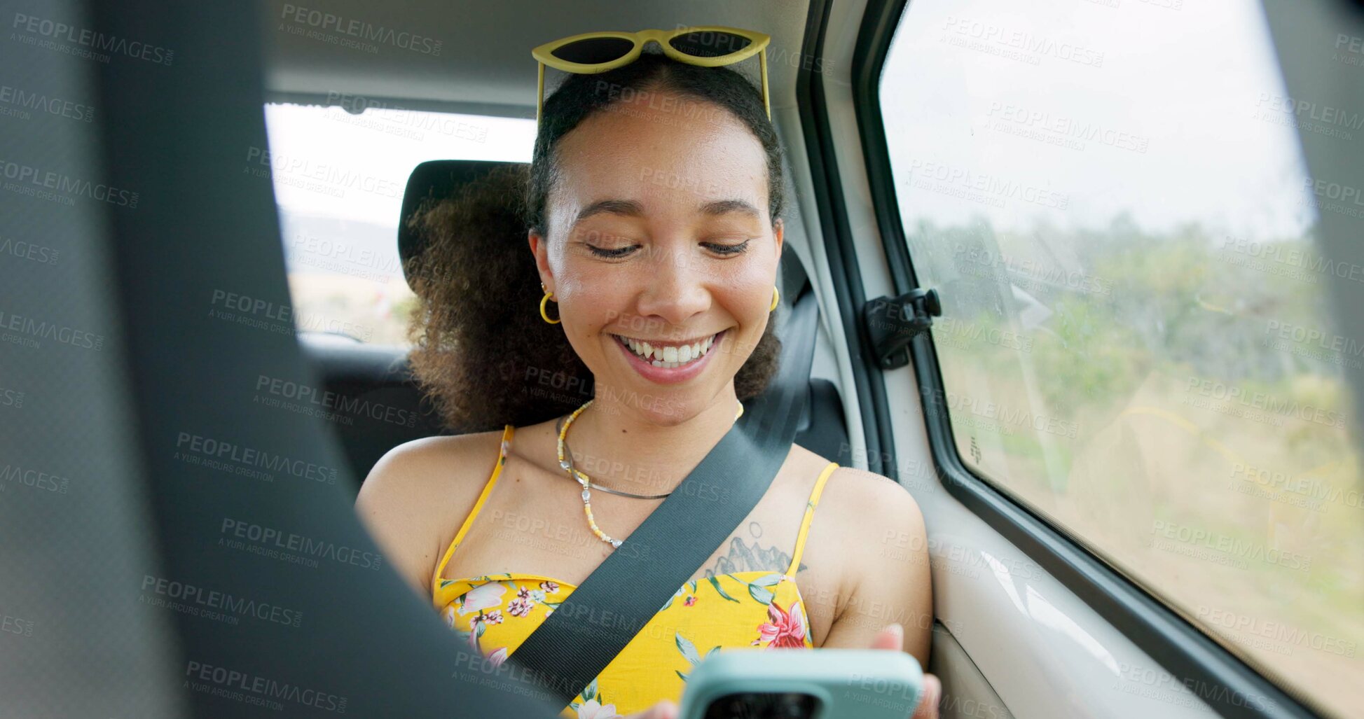 Buy stock photo Woman, phone and texting on road trip, car or laugh at meme, comic video and internet for travel. Girl, smartphone and reading in vehicle with funny blog, social network post or story with transport