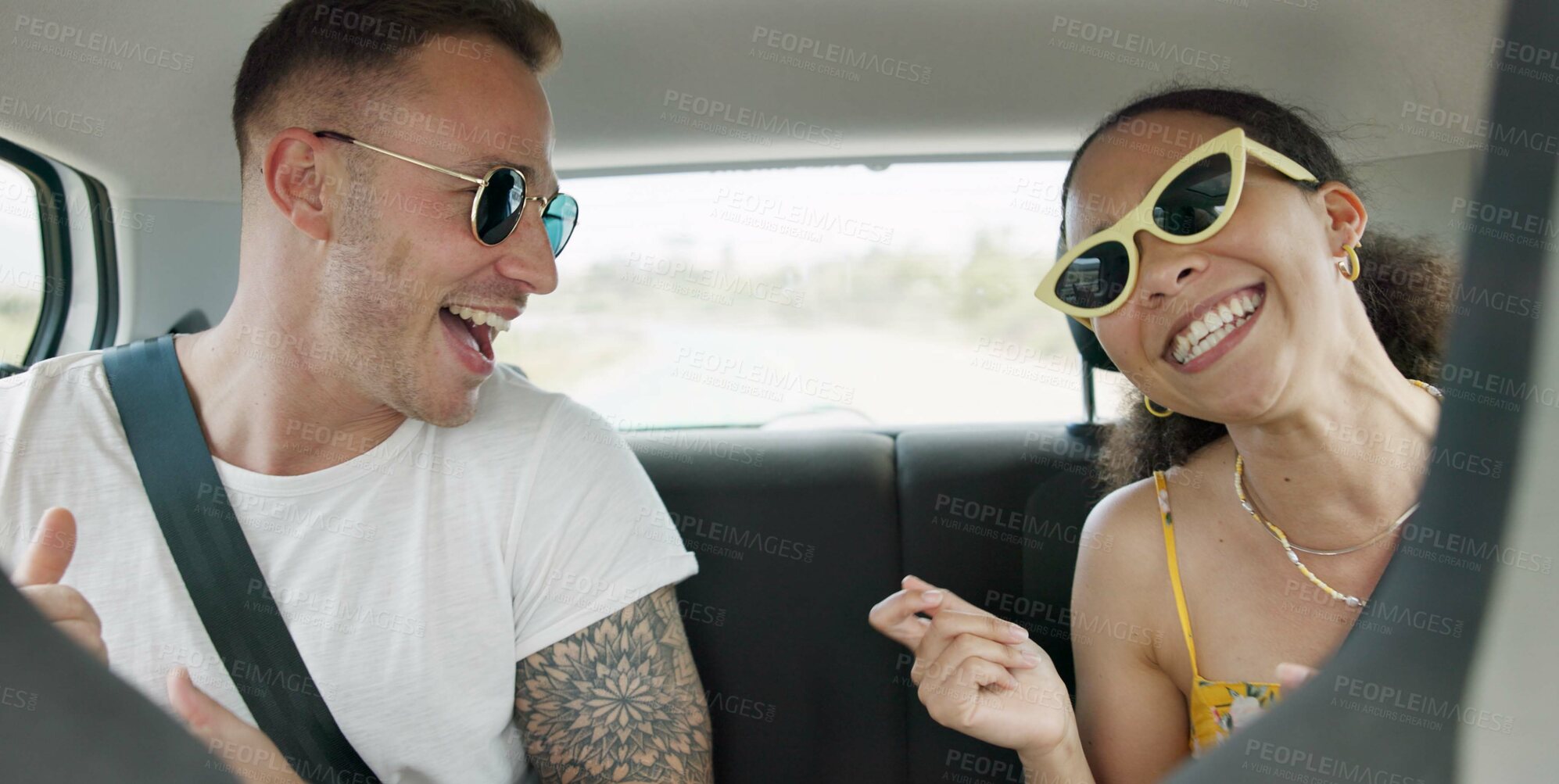 Buy stock photo Singing, dancing and couple in car on road trip in countryside listening to music together. Happy, love and young man and woman moving to song, playlist or radio in vehicle on holiday or adventure.