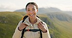 Happy woman, face and backpack with mountain in nature for hiking, adventure or outdoor journey. Portrait of female person, tourist or hiker smile with bag for trekking or climbing on cliff or hills