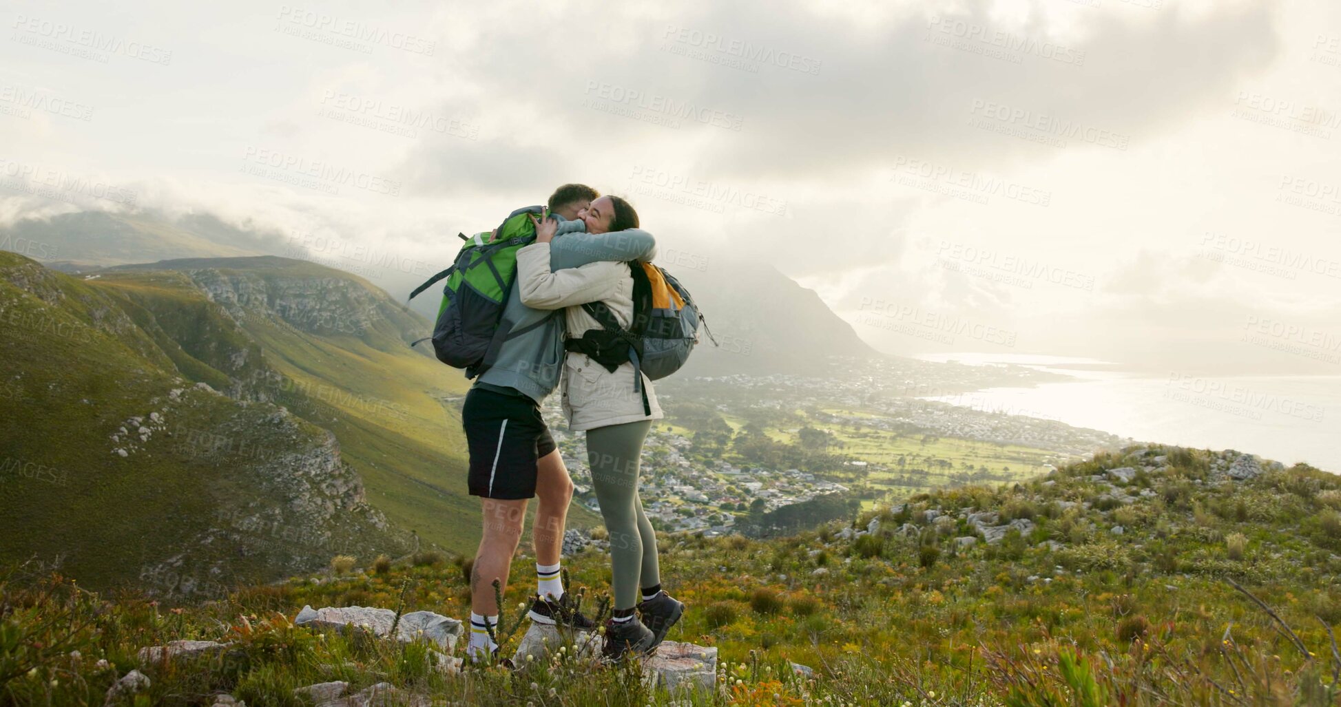 Buy stock photo Couple, high five and hiking on mountains for success, support and travel achievement or goals in nature. Happy people hug with love for outdoor journey and trekking in backpack on eco friendly hills