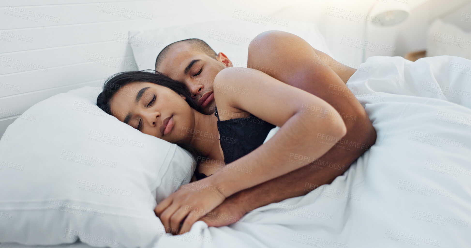 Buy stock photo Couple, hugging and sleeping in bed together, love and resting or comfortable at home on weekend. People, bedroom and security in embrace, bonding and nap on sunday morning and relaxing or dreaming