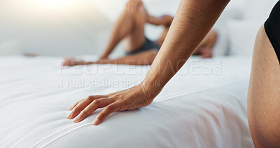 Couple, bed and hands on duvet for love, romance or intimacy in affection, morning or seduction at home. Closeup of woman and man or lovers lying in bedroom for compassion, anniversary or date