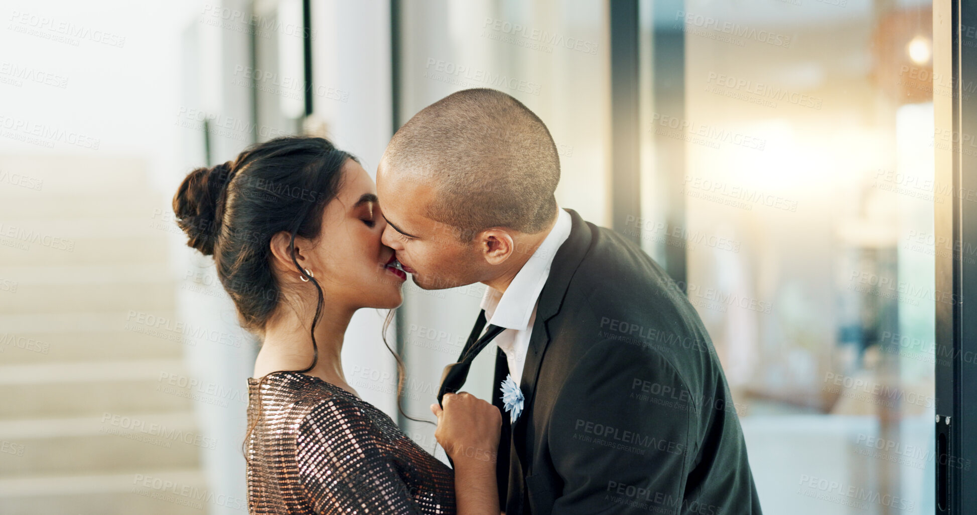 Buy stock photo Couple, love and kiss with passion on a date for formal event, intimacy and romance on valentines day at home. Lovers, woman and man in luxury house, suit and dress for anniversary or relationship