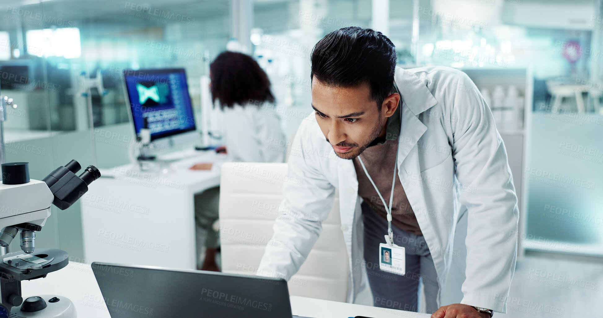 Buy stock photo Scientist, research on laptop and tablet for laboratory test, DNA analysis and results in medical study at night. Serious man with science biotechnology, digital software and a computer for solution