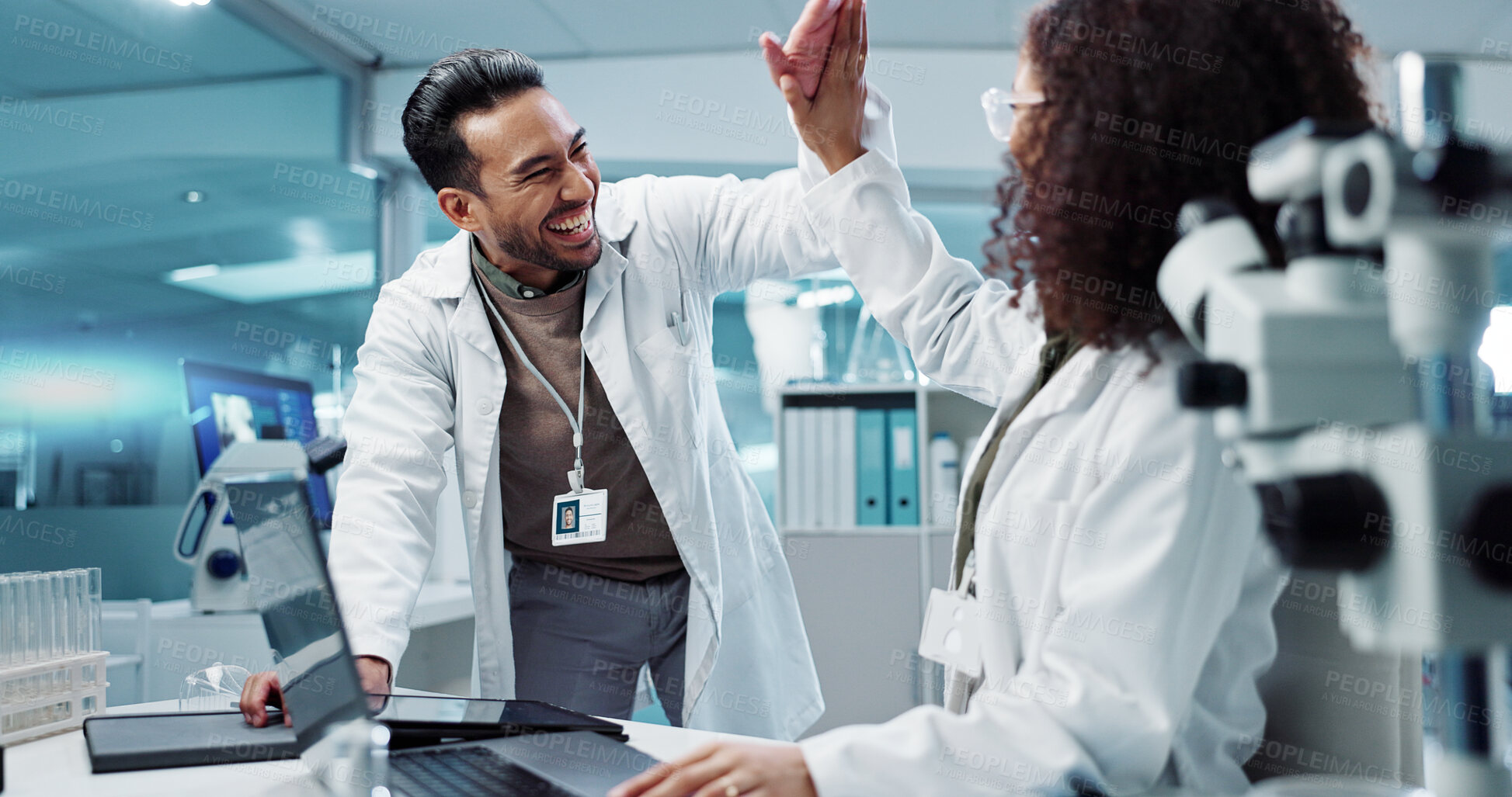 Buy stock photo Scientist, teamwork and high five with laptop in laboratory for test breakthrough, pharmaceutical review or success. Science, collaboration or technology for research, discussion and digital analysis