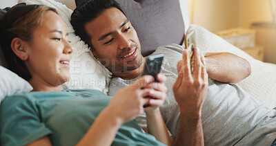 Phone, couple and video mobile streaming of people in bed looking at social media app content. Internet, technology and bedroom web scroll of a girlfriend and boyfriend at home look at a funny meme