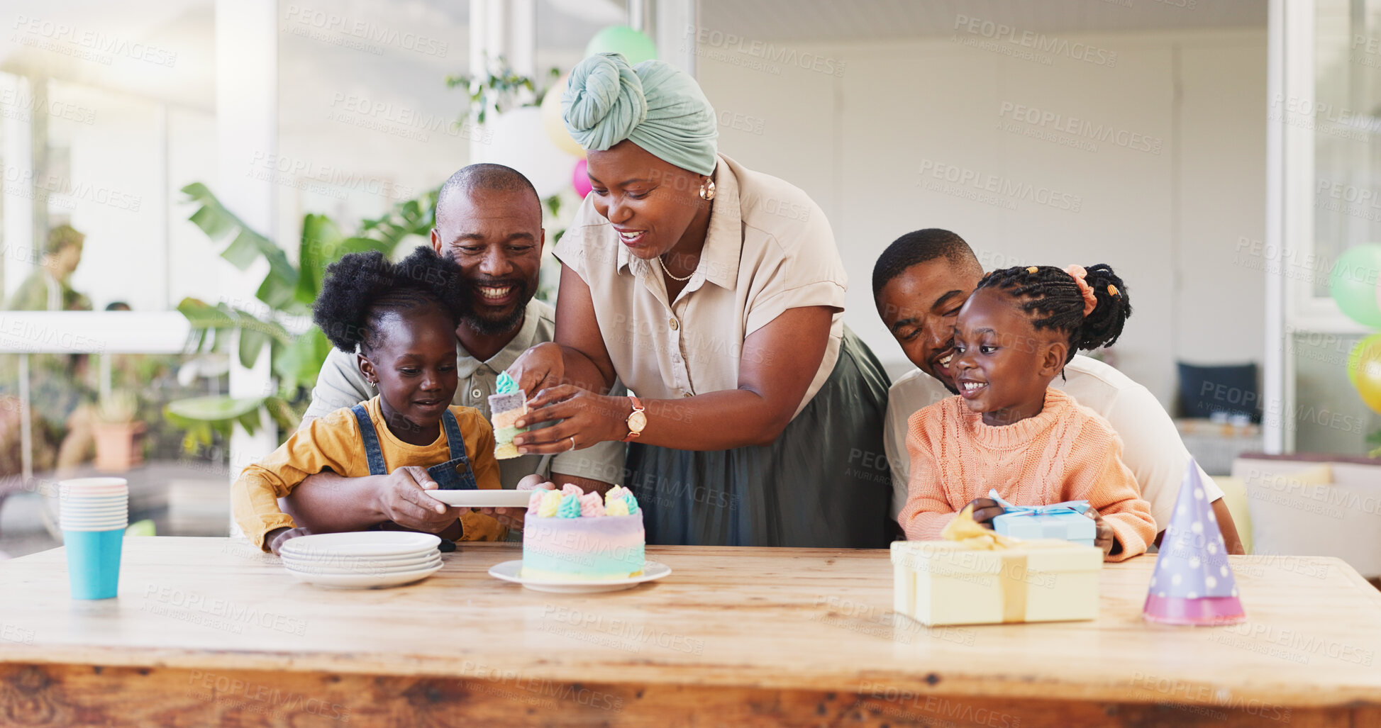 Buy stock photo Birthday party, cake and family, children and parents for eating, celebration and kids at home. African people, mother and dad, kids or girl with dessert or holiday food in backyard or outdoor patio