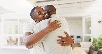 Senior African father, welcome and home with son, hug and love with kindness, bond and happy with care. Dad, black man and excited family with embrace, respect or conversation with smile in Cape Town