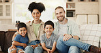 Smile, love and face of a family on sofa for relaxing and bonding together in the living room. Happy, proud and portrait of boy children or kids sitting with their young parents at their modern home.