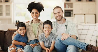 Smile, love and face of a family on sofa for relaxing and bonding together in the living room. Happy, proud and portrait of boy children or kids sitting with their young parents at their modern home.