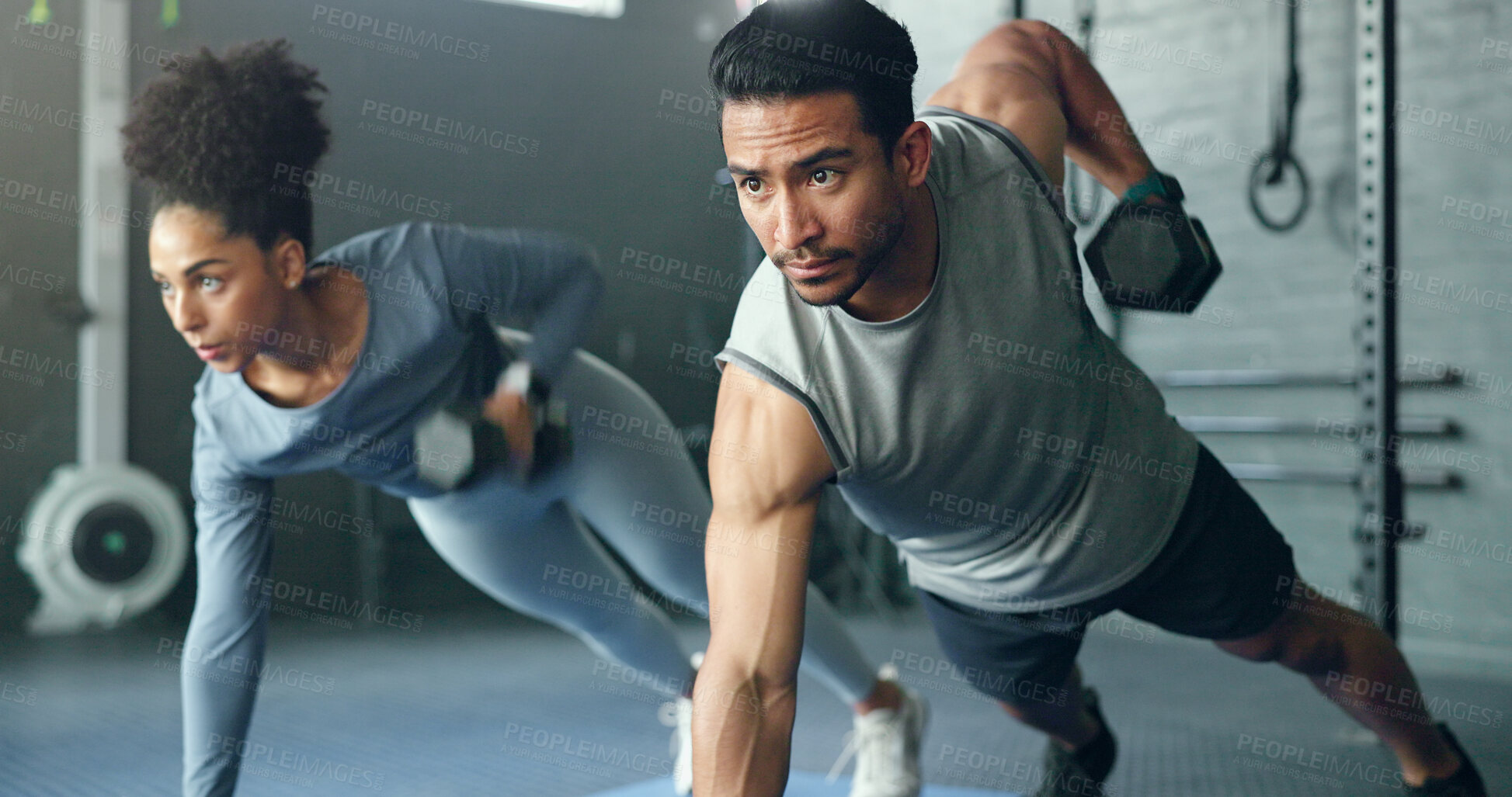 Buy stock photo Fitness, gym and dumbbell, people doing weightlifting and exercise for body training with focus and strong muscle. Man, woman and workout on mat, endurance and serious athlete for active lifestyle.