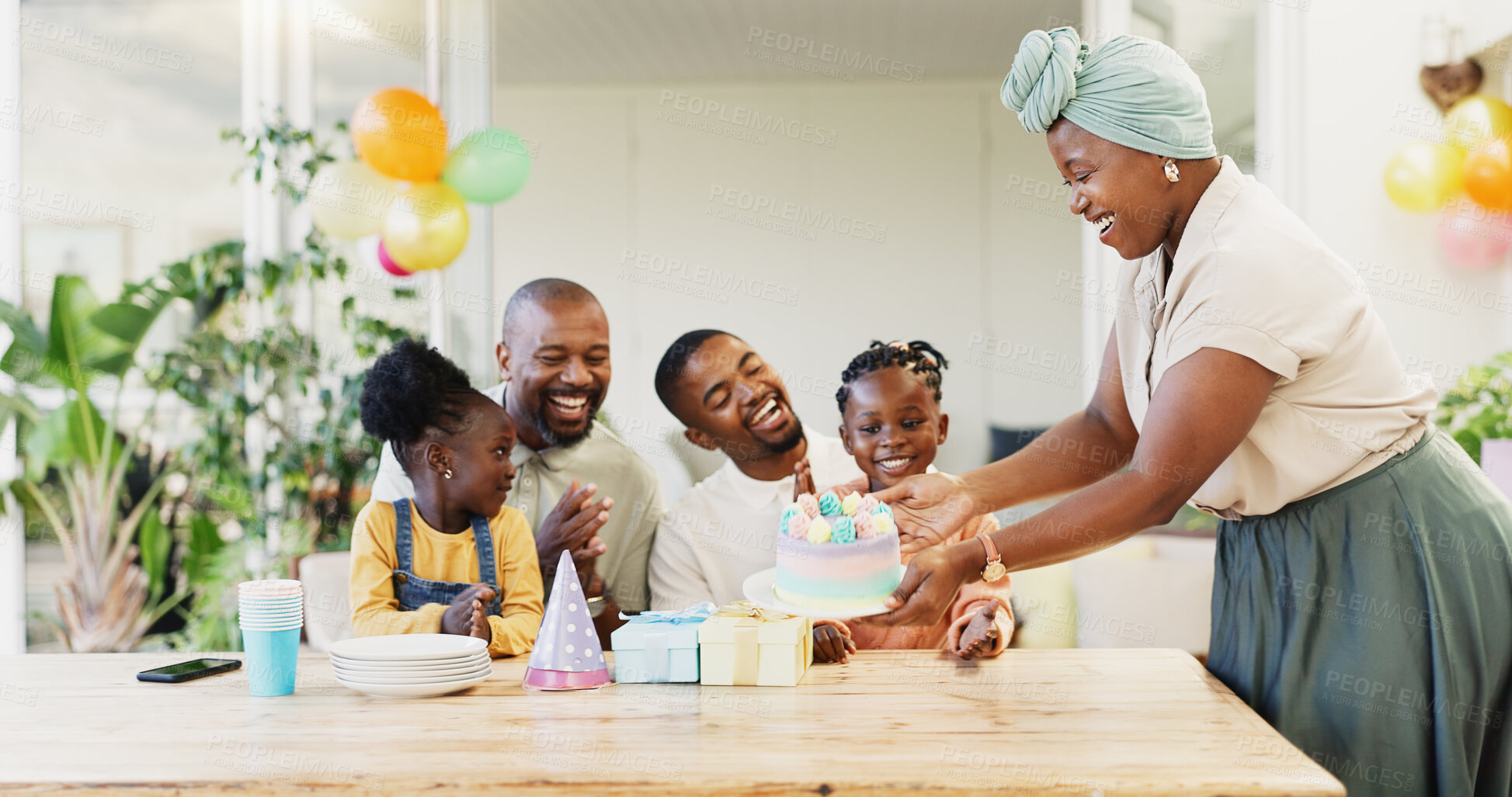 Buy stock photo Birthday cake, family and children with parents for celebration, clapping and cheers for party at home. Happy, excited people, girl or kids with dessert and singing, kiss and love or support on patio