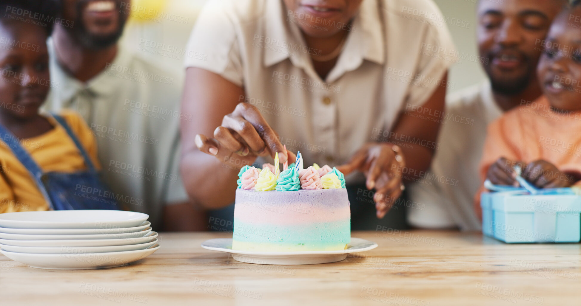 Buy stock photo African family, woman and candle in hands, cake or birthday party for children, parents or happy in home. Men, woman and excited kids for celebration, event or dessert for love, bond or care in house