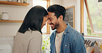 Love, hug and happy couple in a kitchen talking, together and intimate while bonding in their home. Embrace, romance and man with woman hugging, smile and sharing moment, conversation and laughing