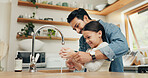 Girl washing her hands with her father in the kitchen for hygiene, health and wellness at home. Child learning to clean her skin with young dad with soap and water to prevent germs, dirt or bacteria.